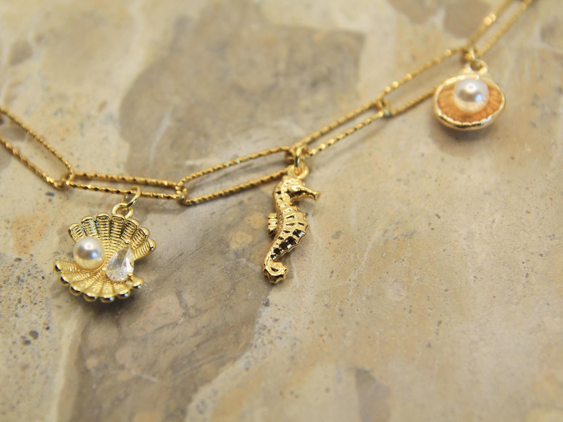 Gold Chunky Charm Beach Inspired Necklace with Pearl, Shells, Starfish and Seahorse