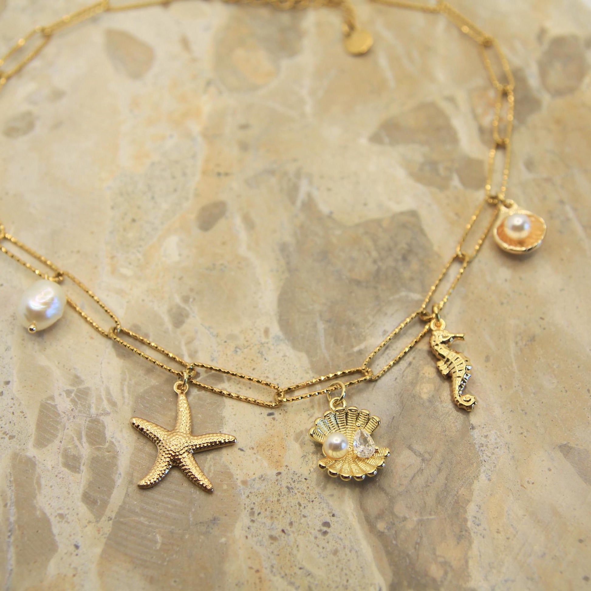 Gold Chunky Charm Beach Inspired Necklace with Pearl, Shells, Starfish and Seahorse