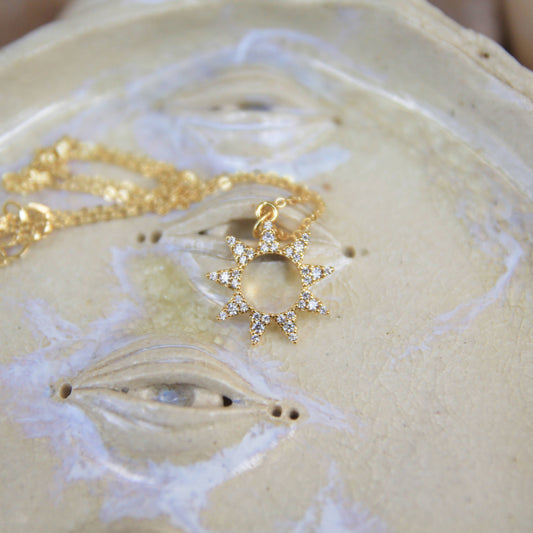 gold sun necklace with cubic zirconia crystals 